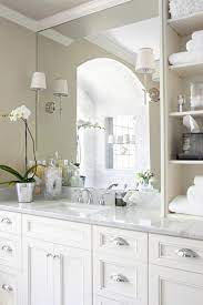 We tend to recommend looking for lighting after the mirror has been chosen to make sure the sconces will fit on the wall with the mirror. How To Drill Holes For Sconce In Mirror
