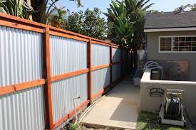 Corrugated metal fencing will last a long time. Residential Sparta Fence