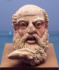 An Etruscan terracotta head depicting an elderly man, with his right hand  touching his long beard. Scholars believe it represents Nestor, one of the  Argonauts who participated in the battle against the