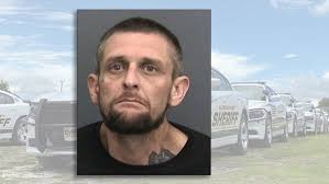 Florida man charged in axe attack