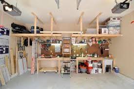 Tips To Create A Simple Garage Workshop Overhead Garage Storage Garage Workshop Layout Garage Workshop