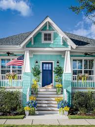 How To Pick The Right Exterior Paint Colors Southern Living Combine varnished timber, plaster and mushroom tones into one snazzy exterior design.