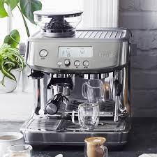 Visitor information is on the coffee table. Breville Barista Pro Sur La Table