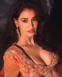 Disha Patani stuns in vibrant orange, serving lush, modern bridesmaid  energy. The bold hue brings just the right amount of drama—festive,  fashion-forward, and perfect for a wedding with a bit of edge.