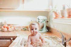 Gather the supplies you'd use for a sponge bath, a cup of rinsing water and baby shampoo, if needed, ahead of time. 8 Best Baby Sink Ideas Baby Baby Photography Baby Photos