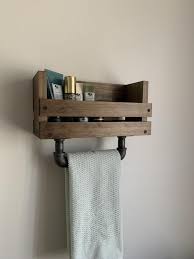 To save space in this small bath, a slim set of shelves is recessed into a wall behind the door. Pin On American Made