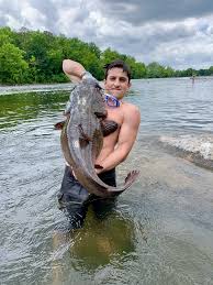 Check Out This Big Flathead Catfish We Caught Noodling In The Local River There S Nothing Like Feeling A Big Ole Flathead Catfish Fishing Fishing Videos Fish