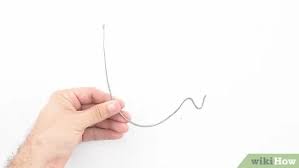 Hook a measuring tape onto the hanging wire attached to the back of the frame (or whatever will be sitting on the nail to hold. 5 Ways To Hang Pictures Without Nails Wikihow