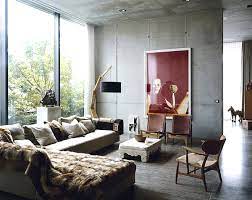 These windows brighten up the wooden table that stands out against the distressed hardwood flooring. Industrial Chic Feminine Masculine Erika Brechtel