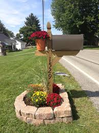 Our Mailbox Recreated Its No Longer Leaning And Plain Everything You See Here Can Be Purchased At Lowes You Can Get A Basic Mailbox Post Or Upgrade Mailbox Landscaping Front Yards
