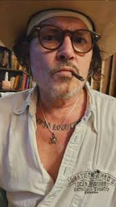 There is someone out there if not more than one person posing online as  being the man that we love and know as Johnny Depp and I am absolutely sick  and by