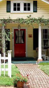 I know that the trend in exterior home colors these days leans toward neutrals, but i love homes cloaked in fun, bold colors. Allison Fouse S Favorites Yellow House Exterior Red Door House House Paint Exterior