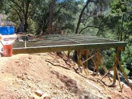 Deck On A Front Hillside Google Search Sloped Backyard Building A Deck Diy Deck