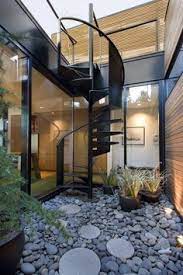 Interior Courtyard A Bit Small Though With Black Steel Spiral Staircase To The Roof Staircase Outdoor Courtyard Gardens Design Stairs Design