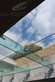 The glass roof is supported on stainless steel fittings (bolted glazing) and is made from tempered laminated solar glass panels. Structural Glass Roof With Glass Fins Glasscon Gmbh Architectural Building Skins Facade Solutions Curtain Walls Glazing Solar Shading Brise Soleil