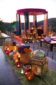 Colorful printed boho rugs, bright blankets and pillows and cushions, leather ottomans and of course lanterns, traditional moroccan lanterns everywhere. Real Wedding Album Elshane Taylor S Moroccan Themed House Party Arabian Nights Wedding Moroccan Party Indian Wedding Decorations