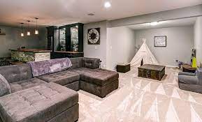 Most carpet has thin padding beneath it to insulate the floor. Basement Flooring Ideas Best Design Options Living Room Decor Rustic Living Room Rug Placement Living Room Design Inspiration