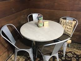 We did not find results for: Novogratz Leo Farmhouse Round Dining Table With Sleek Slanted Metal Legs And Gia Metal Dining Chairs Set Of 4 Antique Vintage Brown Wooden Seat With Back Silver Base Piq