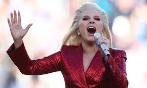 Twitter users think she looked like a character from the hunger games. she wore a blue jacket and a red. Lady Gaga Nails Beautiful Rendition Of Star Spangled Banner For The Win
