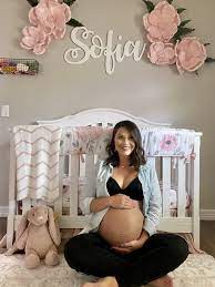Diy At Home Maternity Pictures In Nursery Bedroom Maternity Photos Diy Maternity Photos Indoor Maternity Photos