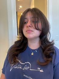 Who is a mobile barber in St George?