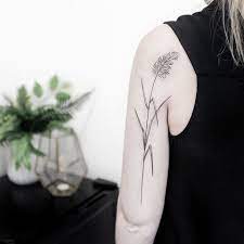 Reed Plant Tattoo On The Back Of The Left Arm Plant Tattoo Tattoos Cool Arm Tattoos