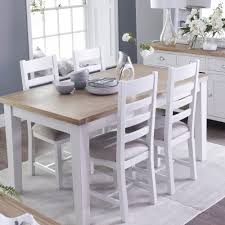 Teak dining table with glass top and four chairs with the dimensions of 3 feet by 3 feet. Thames Dining Table 4 Chairs Cookes Furniture
