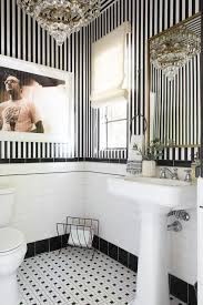 The shelving unit provides an abundance of storage for cotton balls and daily items as well as fun decorating pieces like jars filled with seashells. 30 Bathroom Decorating Ideas On A Budget Chic And Affordable Bathroom Decor