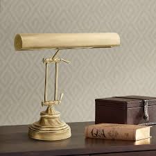 The structure and piano finish for aesthetic purposes to determine if it would complement the furniture and color scheme of the room where one plans to put it. House Of Troy Round Base Upright Antique Brass Piano Lamp 01016 Lamps Plus