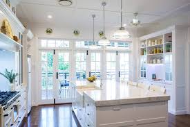 Choose the right pendant lights for your kitchen island. Traditional Pendant Lighting Above Island Bench With French Doors Opening Onto The Deck Makings Of Fine Kitchens Brisbane