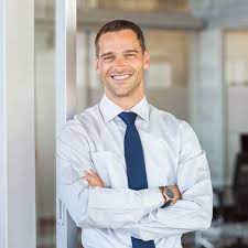 Male professional architect in safety vest and helmet posing on roof. 40 Best Headshot Poses How To Pose For Headshots Fixthephoto