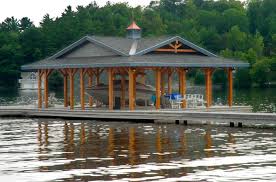 These structures will float on the water and move up and down depending on the water level, so flood load really doesn't affect these structures. House Plans Mcmillan Boathouse Linwood Custom Homes