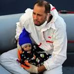 Shivering migrant baby plucked from