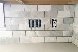 After waiting at least 24 hours, seal the grout using the sealer product and a clean cloth if required. How To Install A Marble Subway Tile Backsplash Abby Lawson