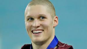 Conner McHugh swims to NCAA's second-best breaststroke time for Gophers