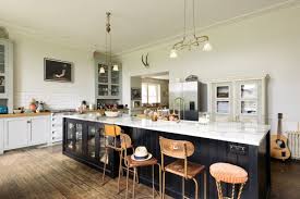 I love the xo relief tiles that create the white backsplash. 40 Kitchen Island Ideas With Seating Storage And More Real Homes