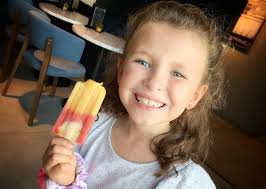 Maddie is ALL about the Paletas! Fresh fruit ice mix made from pineapple,  strawberry and coconut
