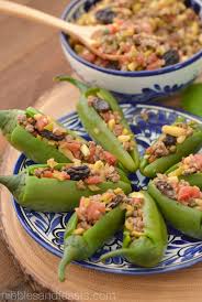 Stuffed Jalapeno Peppers Nibbles And Feasts Recipe Stuffed Jalapeno Peppers Stuffed Peppers Mexican Food Recipes