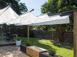 Here's how to create a large canopy using cheap, simple materials. How To Build An Outdoor Canopy Hgtv
