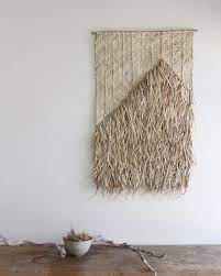 the dharma door on instagram layer upon layer of handcrafted palm fringe attached to beautifully woven matting the amua wall hanging the dharma door hanging