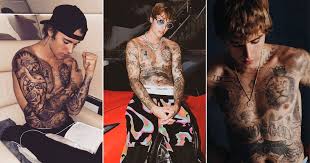 Around his left ankle is a pair of praying hands with. Justin Bieber Birthday Special Crosses Text Birds More Check Out The Meaning Behind His Many Tattoos