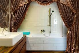 Luxurious shower curtains are taking the interior design world by storm. Decorating With Double Swag Shower Curtains Lovetoknow