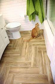 From kitchen backsplashes to bathroom walls, herringbone has long been used as a favorite pattern with tile. Herringbone Plank Idea For Bathroom Floor Except Put It On The Diagonal Not Straight Flooring Herringbone Tile Floors Plank Flooring