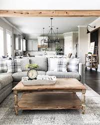 The wooden coffee table, as well as the chandelier, brought some farmhouse appeal to the space. Diy Rustic Living Room Decor Rustic Colors For Living Room Rustic Country Liv Farm House Living Room Farmhouse Style Living Room Modern Farmhouse Living Room