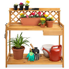 This potting bench comes equipped with a sink, which is more than you can wish for in such an affordable bench. Amazon Com Best Choice Products Outdoor Garden Potting Bench Wooden Workstation Table W Cabinet Drawer Open Shelf Lower Storage Lattice Back Natural Garden Outdoor