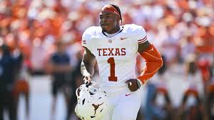 Texas Longhorns football player Colin Simmons being carted off with a leg injury during the 2026 game against Florida