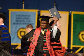 A Kent State Graduate Celebrates During The Morning Commencement Ceremony College Experience Ceremony In This Moment