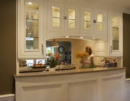 Cabinets Over Bar With Doors On Both Sides And Lights Underneath Budget Kitchen Remodel Kitchen Layout Kitchen Design