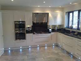 Thankfully there is plenty of choice out there when it what i mean is that you can create a stunning effect with a painted kitchen or a high gloss cream kitchen by putting a glossy ceramic tile with it. Cream Gloss Kitchen With White Tiles Novocom Top