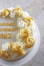 To answer how to decorate a cake with icing sugar; How To Make Shimmery Buttercream Roses 50th Anniversary Cake Rose Bakes